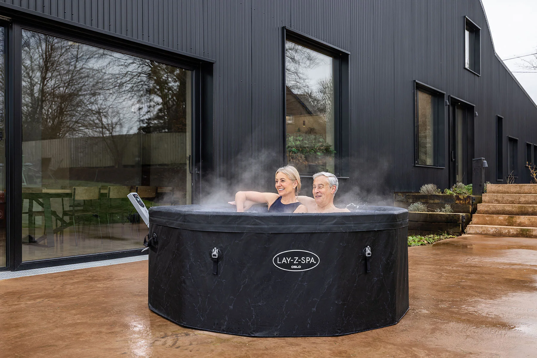 hot-tub-for-whole-family-large-round Lay-Z-Spa Oslo 6 Person AirJet Foam Wall Hot Tub - Image 1